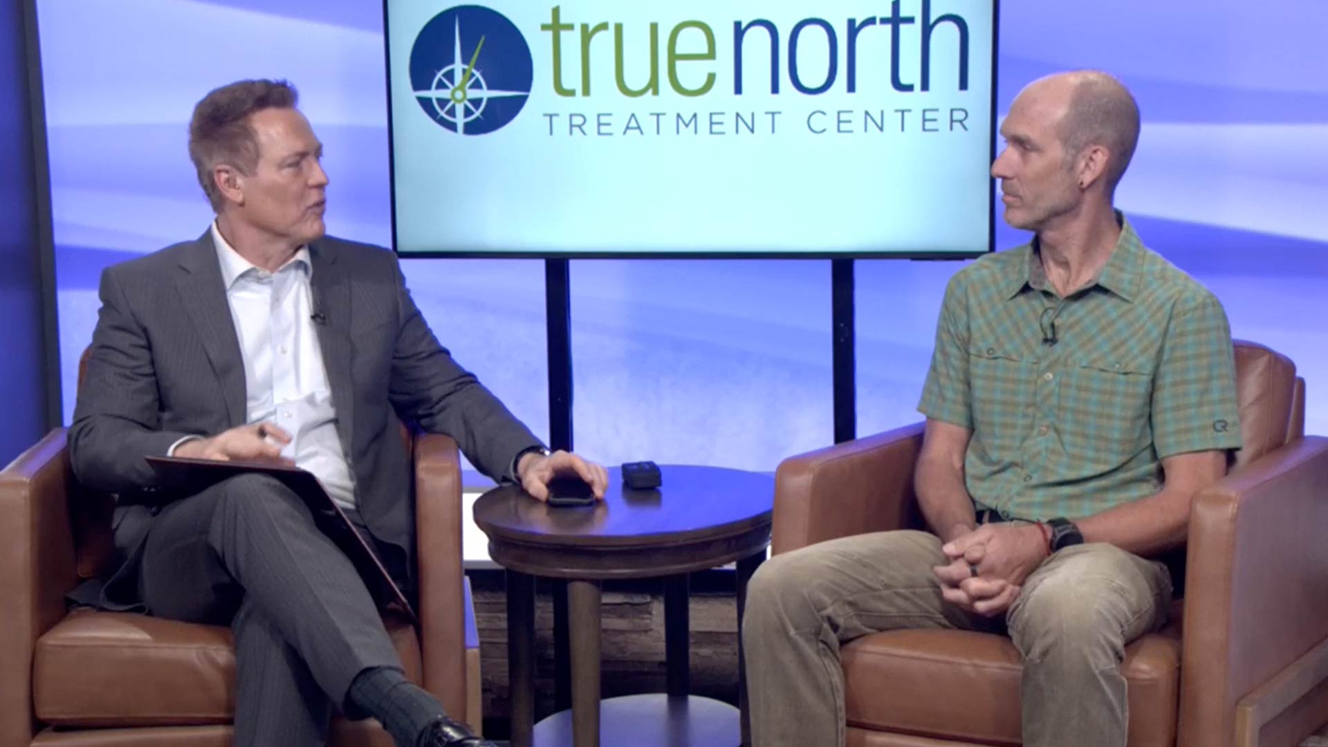 Dave Briggs speaking at the Reno News Fox 11 studio for a Therapy Thursday discussion