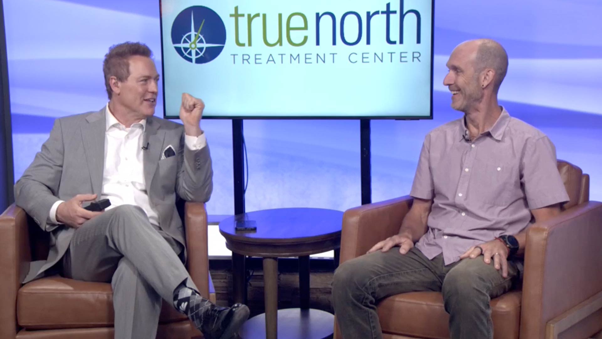 Dave Briggs speaking at the Reno News Fox 11 studio for a Therapy Thursday discussion