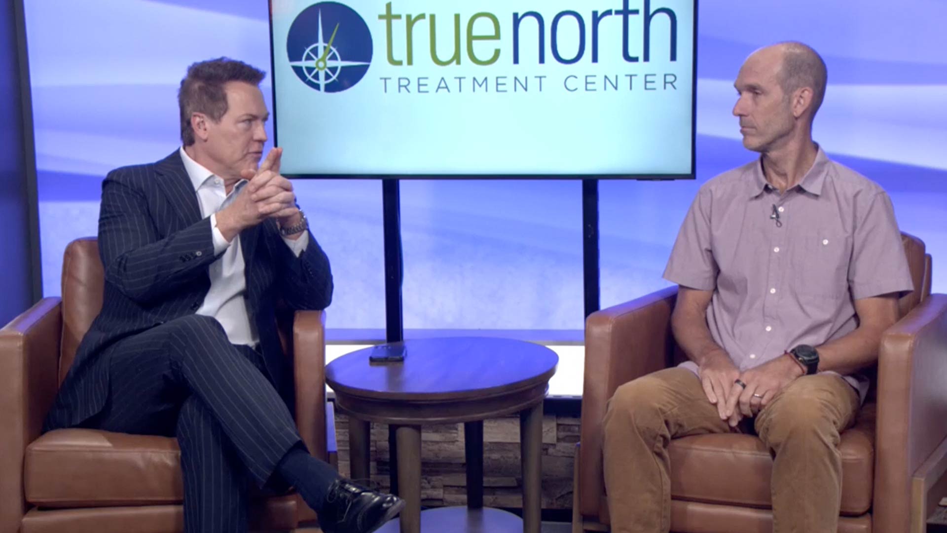 Dave Briggs speaking at the Reno News Fox 11 studio for a Therapy Thursday discussion