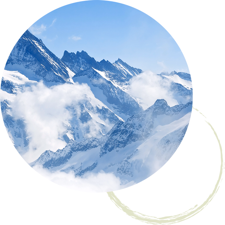 Jagged snowy mountains with clouds