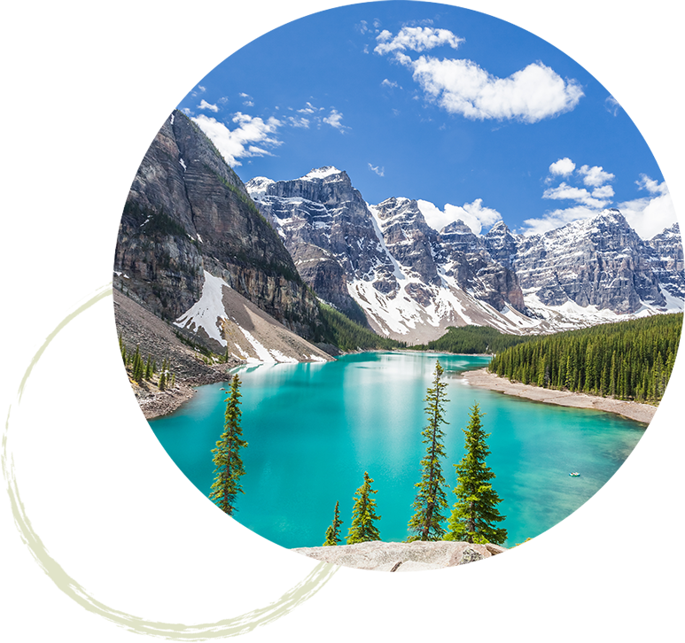 Snow capped mountains surrounding a clear, turquoise lake